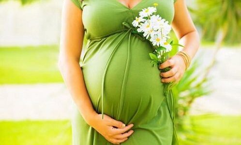 Pregnant woman with varicose veins in her legs.